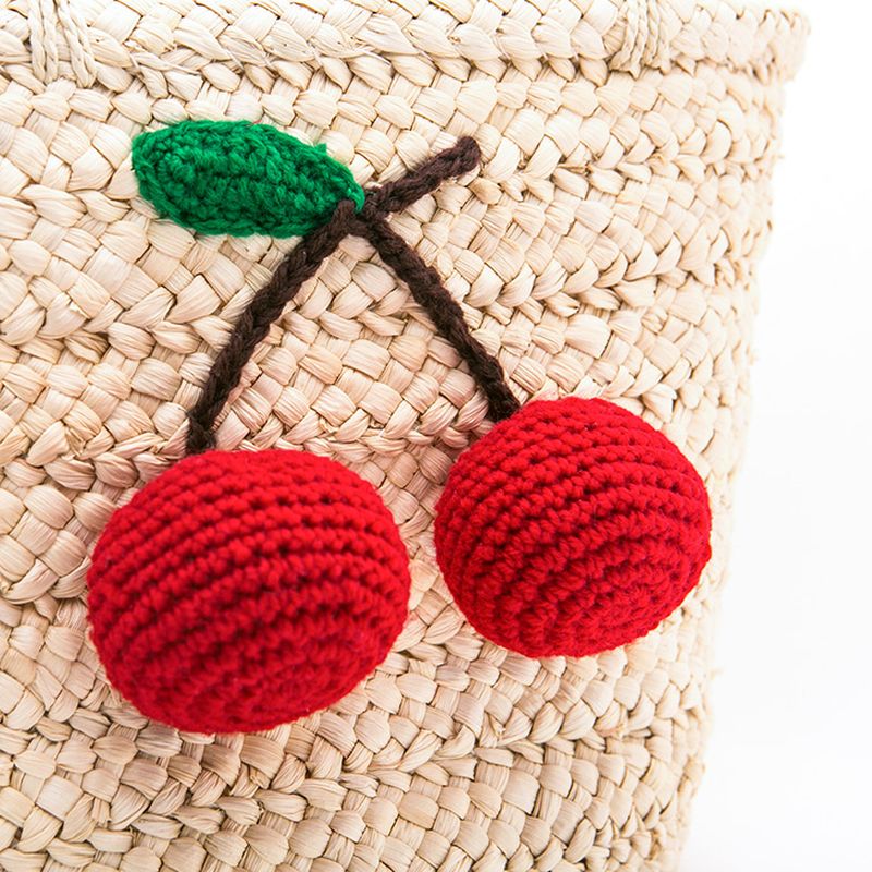 corn husk straw shoulder bag with strawberry trim
